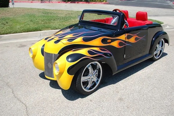 Black 39 Roadster with Yellow Flames affordable golf cart rental, golf cart rent bimini