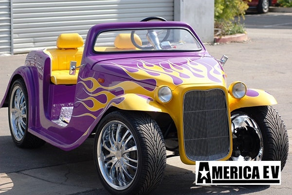 Purple California Roadster with Yellow Flames affordable golf cart rental, golf cart rent bimini
