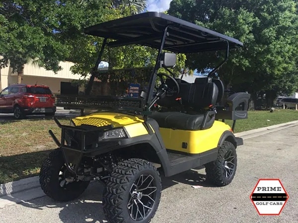 Yellow Aluma 4 Passenger Lifted Golf Cart affordable golf cart rental, golf cart rent bimini
